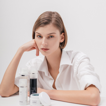 Load image into Gallery viewer, Woman with a part of Azra Botanical Simpilicity Skincare collection
